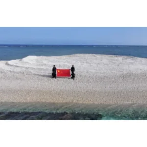China Plants Flag on Disputed Sandy Cay Reef Near Philippine Military Outpost