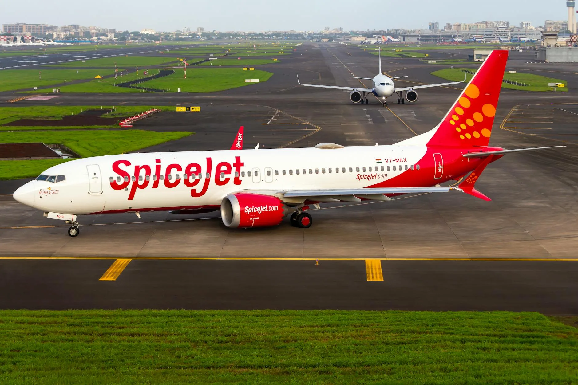 parked airplane in an airport runway