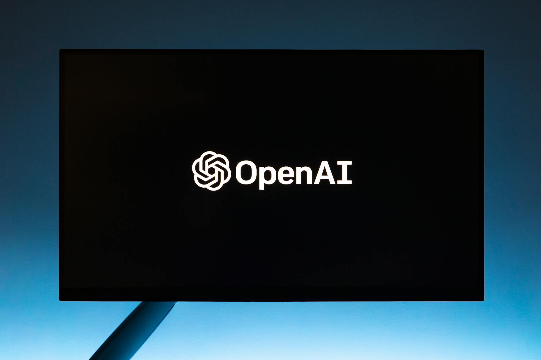 OpenAI Reports $4.3 Billion Revenue in First Half of 2025 1 Your Pulse on Stocks, Finance, Markets & the Global Economy openai text on tv screen
