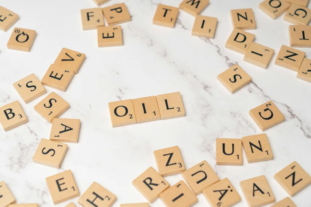 the word oil spelled out in scrabble tiles
