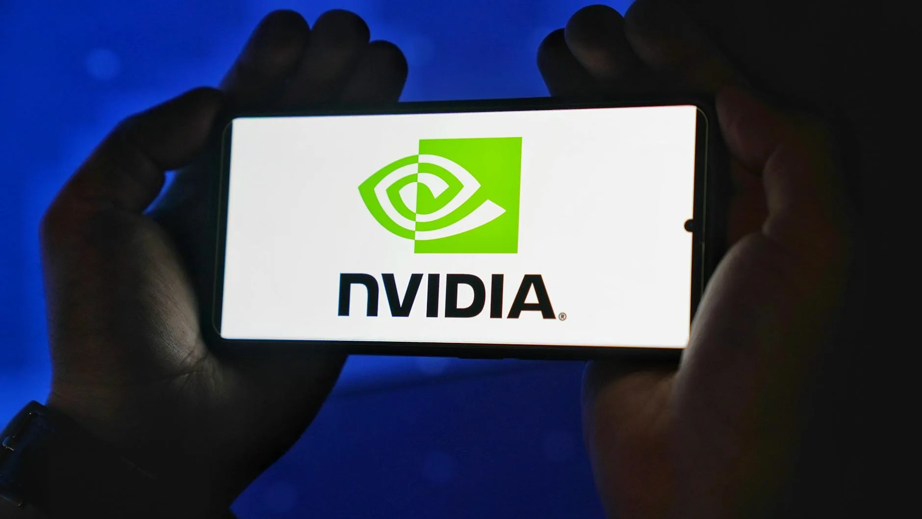U.S. Approves Conditional Nvidia H200 Shipments to China: 25% Fee to America 1 Your Pulse on Stocks, Finance, Markets & the Global Economy close up of nvidia logo displayed on smartphone