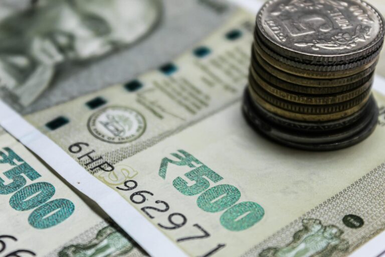 close up photo of banknotes and coins