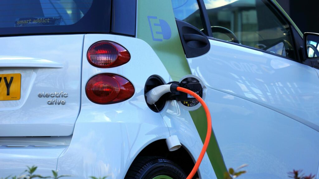 Delhi EV Policy 2026–30 Targets Faster Electric Shift 1 Your Pulse on Stocks, Finance, Markets & the Global Economy white and orange gasoline nozzle